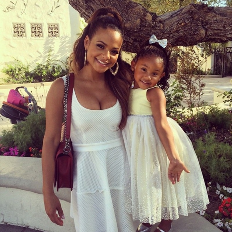 Christina Milian and Violet Madison ash in white gowns.